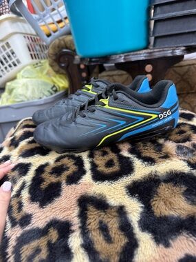 DSG Kids Black Soccer Sneakers with Blue and Yellow Accents